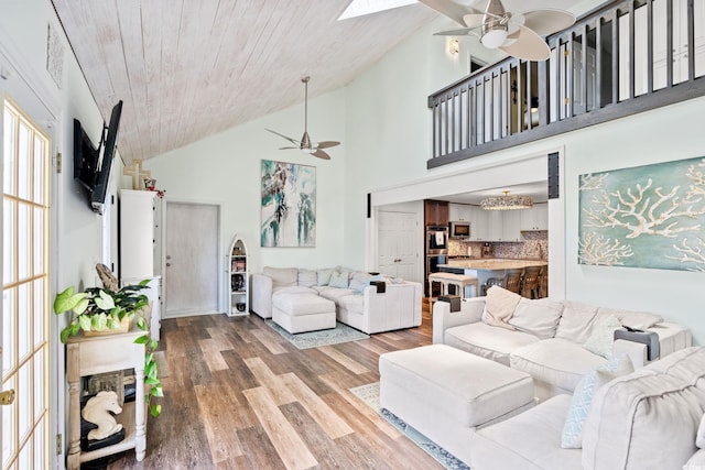 4806 S Ocean Blvd, Surfside Beach, SC 29575 - living area with ceiling fan, light wood-style floors, high vaulted ceiling, wood ceiling, and a skylight