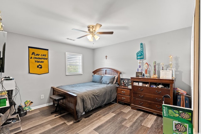 4806 S Ocean Blvd, Surfside Beach, SC 29575 - bedroom with wood finished floors and a ceiling fan