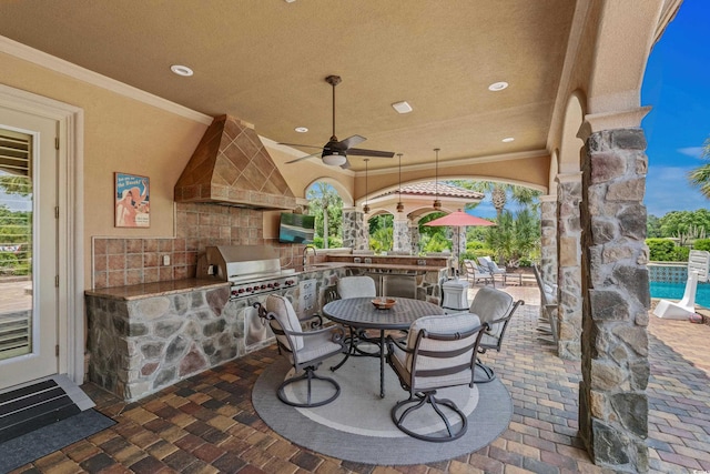 9737 Catalonia Ct, Myrtle Beach, SC 29579 - view of patio / terrace featuring exterior kitchen, a ceiling fan, and a swimming pool