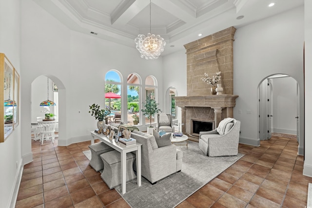 9737 Catalonia Ct, Myrtle Beach, SC 29579 - living room featuring a towering ceiling, arched walkways, recessed lighting, coffered ceiling, and ornamental molding