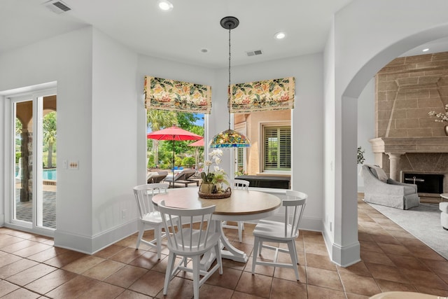 9737 Catalonia Ct, Myrtle Beach, SC 29579 - dining room with arched walkways, recessed lighting, and tile patterned floors