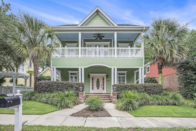 1613 James Island Ave, North Myrtle Beach, SC 29582 - view of front of home featuring a balcony, a ceiling fan, and a porch