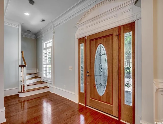 1613 James Island Ave, North Myrtle Beach, SC 29582 - foyer entrance featuring healthy amount of natural light, wood finished floors, ornamental molding, and stairs