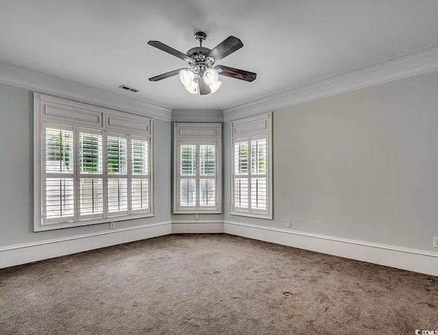1613 James Island Ave, North Myrtle Beach, SC 29582 - spare room featuring ornamental molding, carpet, and a ceiling fan