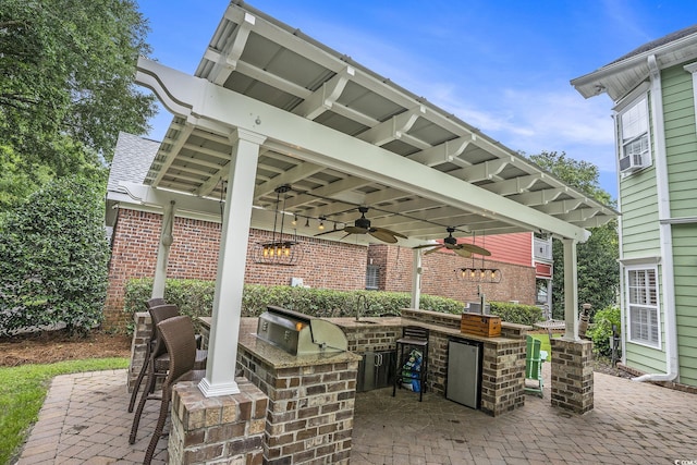 1613 James Island Ave, North Myrtle Beach, SC 29582 - view of patio with exterior kitchen, a ceiling fan, and cooling unit