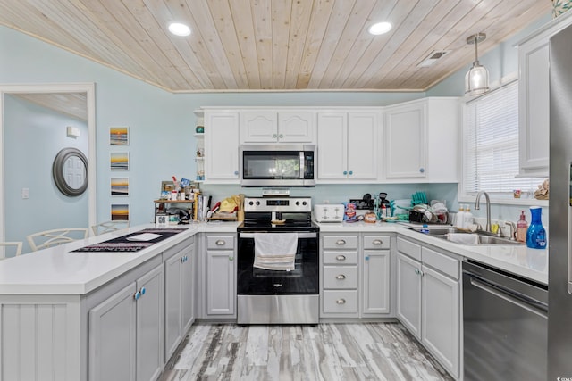 10071 Kings Rd, Myrtle Beach, SC 29572 - kitchen featuring appliances with stainless steel finishes, a peninsula, recessed lighting, wooden ceiling, and open shelves