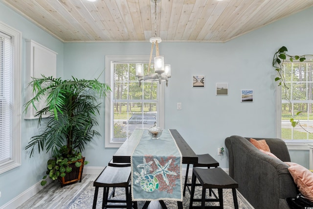 10071 Kings Rd, Myrtle Beach, SC 29572 - dining space with a chandelier, crown molding, light wood-style floors, and wooden ceiling