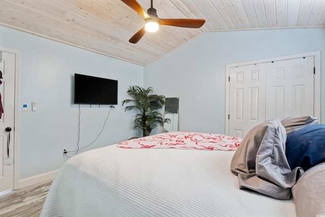 10071 Kings Rd, Myrtle Beach, SC 29572 - bedroom featuring light wood-style floors, wooden ceiling, vaulted ceiling, ceiling fan, and a closet