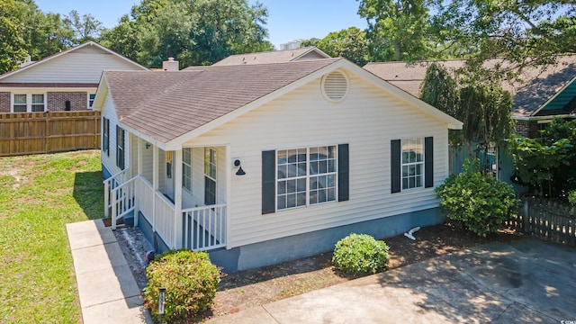 10071 Kings Rd, Myrtle Beach, SC 29572 - view of front of house with roof with shingles and a porch