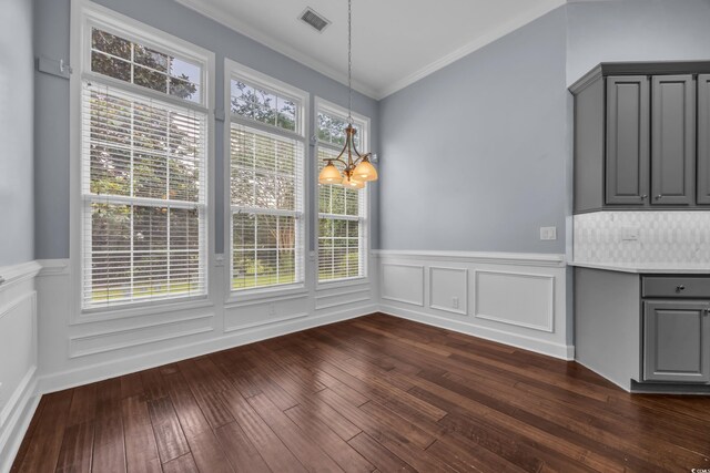 760 Carolina Farms Blvd, Myrtle Beach, SC 29579 - unfurnished dining area with crown molding, a wainscoted wall, dark wood-type flooring, a chandelier, and a decorative wall