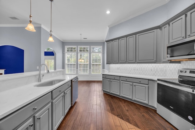 760 Carolina Farms Blvd, Myrtle Beach, SC 29579 - kitchen featuring gray cabinetry, appliances with stainless steel finishes, crown molding, backsplash, and pendant lighting