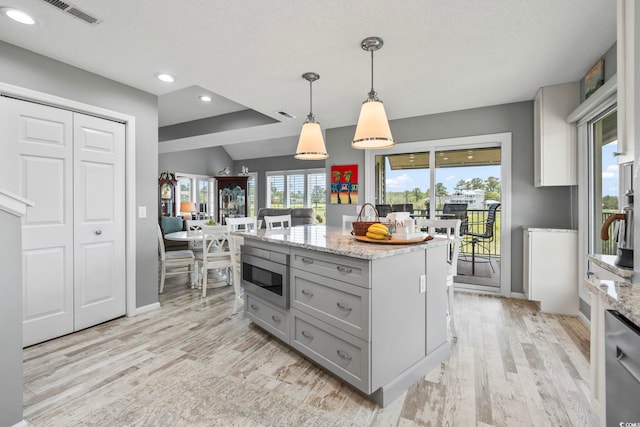 1663 Harbor Dr, North Myrtle Beach, SC 29582 - kitchen featuring stainless steel appliances, gray cabinetry, light wood-style floors, recessed lighting, and light stone countertops