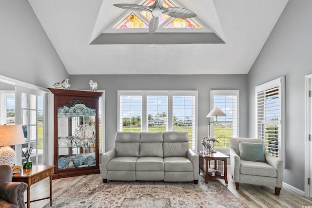 1663 Harbor Dr, North Myrtle Beach, SC 29582 - living room featuring vaulted ceiling, wood finished floors, and a ceiling fan