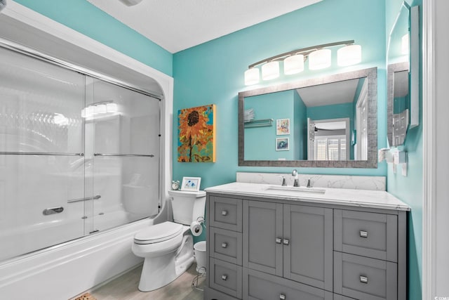 1663 Harbor Dr, North Myrtle Beach, SC 29582 - bathroom featuring vanity, bath / shower combo with glass door, and wood finished floors