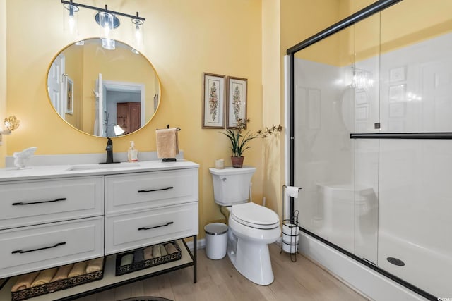 1663 Harbor Dr, North Myrtle Beach, SC 29582 - bathroom with a shower with door, vanity, and wood finished floors