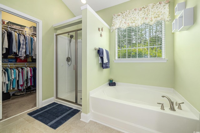 2010 Chattooga Ct, Myrtle Beach, SC 29588 - full bathroom featuring a garden tub, a shower stall, a walk in closet, and tile patterned flooring