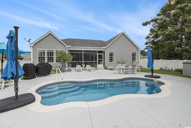2010 Chattooga Ct, Myrtle Beach, SC 29588 - view of pool with a patio, a sunroom, and outdoor dining space