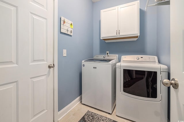 2010 Chattooga Ct, Myrtle Beach, SC 29588 - washroom featuring washer and clothes dryer, cabinet space, and light tile patterned floors