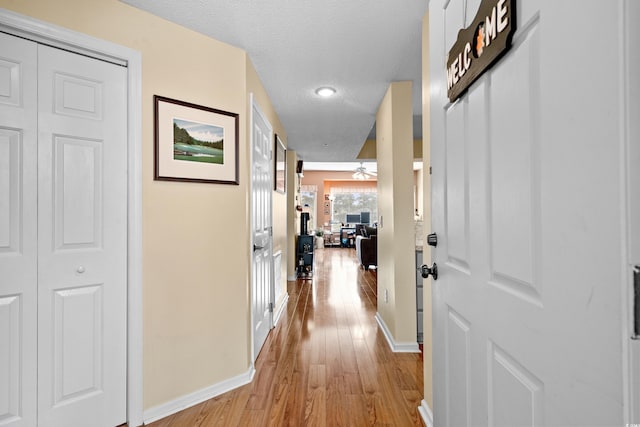 1401 Lighthouse Dr Unit 4334, North Myrtle Beach, SC 29582 - hallway featuring light wood finished floors, a textured ceiling, and recessed lighting