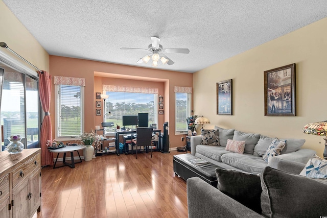 1401 Lighthouse Dr Unit 4334, North Myrtle Beach, SC 29582 - living area featuring a ceiling fan, wood finished floors, a textured ceiling, and a desk