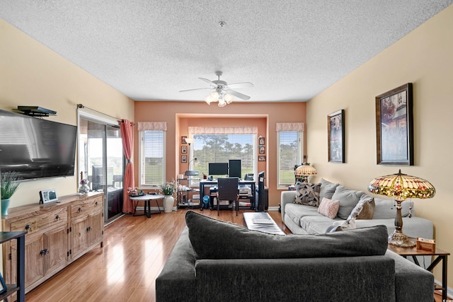 1401 Lighthouse Dr Unit 4334, North Myrtle Beach, SC 29582 - living room with light wood-style flooring, plenty of natural light, ceiling fan, and a textured ceiling