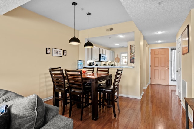 1401 Lighthouse Dr Unit 4334, North Myrtle Beach, SC 29582 - dining room featuring baseboards and wood finished floors