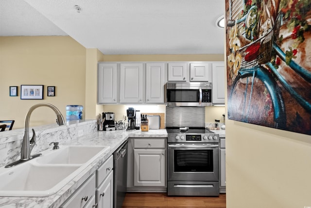 1401 Lighthouse Dr Unit 4334, North Myrtle Beach, SC 29582 - kitchen featuring appliances with stainless steel finishes, a peninsula, dark wood-style floors, and light countertops