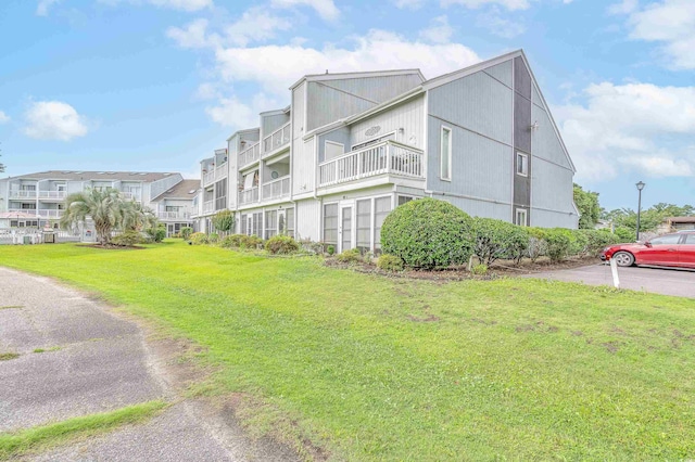 3700 Golf Colony Ln Unit 26A, Little River, SC 29566 - view of side of property with a yard and a residential view