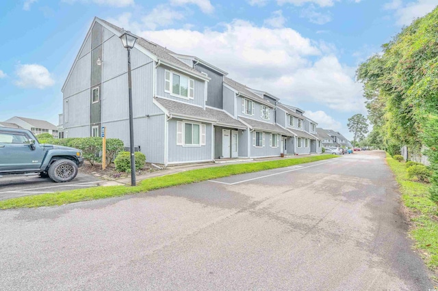 3700 Golf Colony Ln Unit 26A, Little River, SC 29566 - view of front facade with uncovered parking, a residential view, and a shingled roof