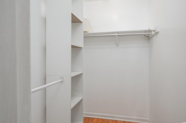 3700 Golf Colony Ln Unit 26A, Little River, SC 29566 - walk in closet featuring wood finished floors