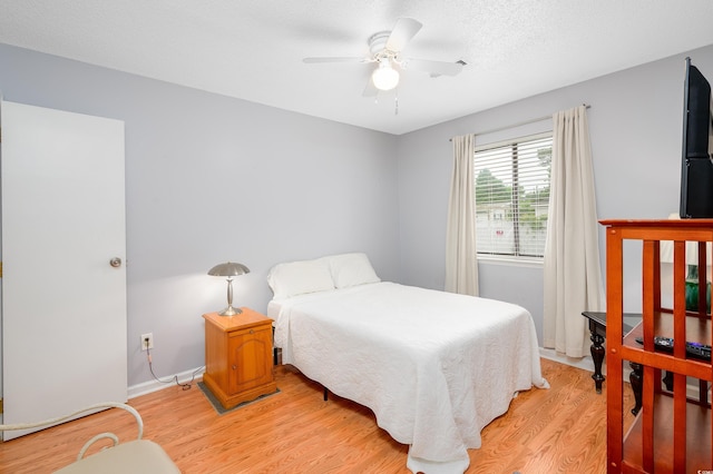 3700 Golf Colony Ln Unit 26A, Little River, SC 29566 - bedroom with light wood finished floors and a ceiling fan