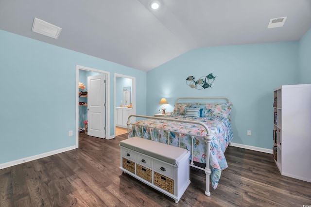 1520 Jardine Loop, Little River, SC 29566 - bedroom featuring vaulted ceiling, wood finished floors, a walk in closet, and connected bathroom