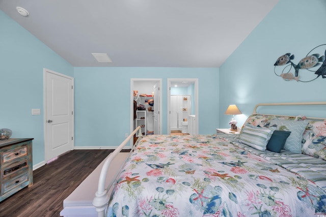 1520 Jardine Loop, Little River, SC 29566 - bedroom featuring dark wood-style floors, a walk in closet, ensuite bath, a closet, and lofted ceiling
