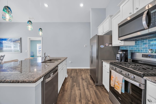 1520 Jardine Loop, Little River, SC 29566 - kitchen featuring appliances with stainless steel finishes, dark wood-type flooring, dark stone countertops, white cabinetry, and decorative backsplash