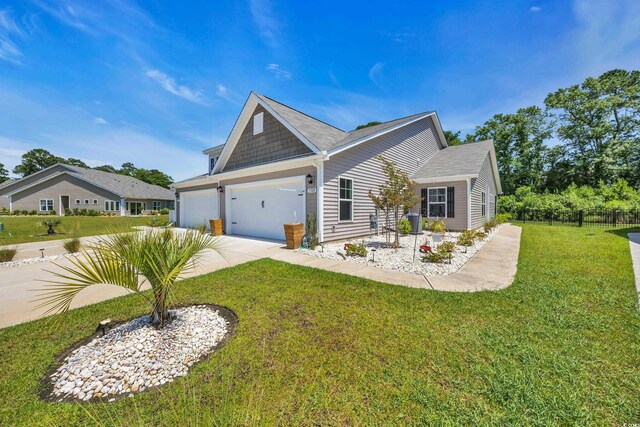 1520 Jardine Loop, Little River, SC 29566 - view of front facade with concrete driveway, a front lawn, and a garage