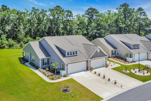 1520 Jardine Loop, Little River, SC 29566 - view of front of property with driveway, a front yard, a shingled roof, and an attached garage