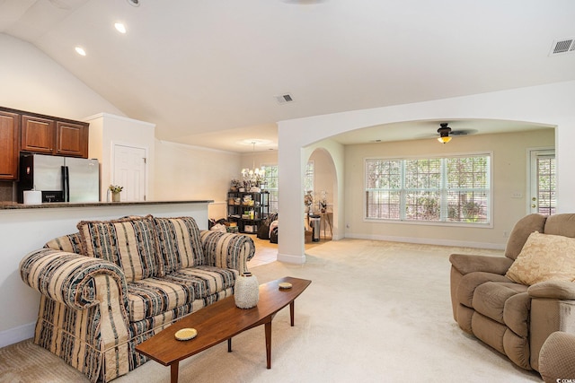 364 Vesta Dr, Myrtle Beach, SC 29579 - living room featuring arched walkways, light carpet, a chandelier, vaulted ceiling, and a ceiling fan