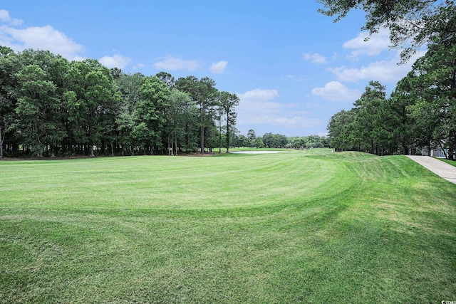 364 Vesta Dr, Myrtle Beach, SC 29579 - view of community with a lawn, view of golf course, and view of wooded area