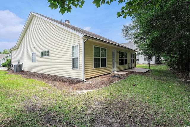 364 Vesta Dr, Myrtle Beach, SC 29579 - view of home's exterior featuring a yard, a chimney, and a shingled roof