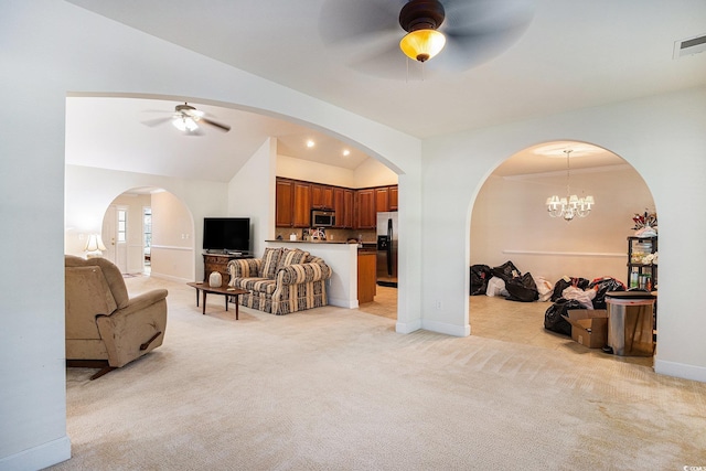 364 Vesta Dr, Myrtle Beach, SC 29579 - living area featuring a ceiling fan, vaulted ceiling, light carpet, and arched walkways