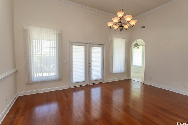 413 Sea Vista Ln, North Myrtle Beach, SC 29582 - empty room with a chandelier, plenty of natural light, wood-type flooring, and ornamental molding