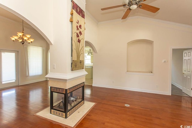 413 Sea Vista Ln, North Myrtle Beach, SC 29582 - unfurnished living room featuring arched walkways, a chandelier, high vaulted ceiling, a ceiling fan, and wood finished floors