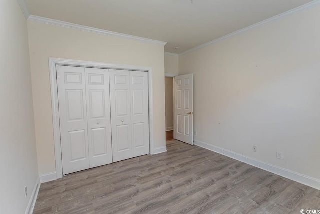 413 Sea Vista Ln, North Myrtle Beach, SC 29582 - unfurnished bedroom with crown molding, wood finished floors, and a closet