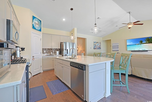232 Angel Wing Dr, Myrtle Beach, SC 29588 - kitchen with appliances with stainless steel finishes, tasteful backsplash, wood finished floors, open floor plan, and lofted ceiling