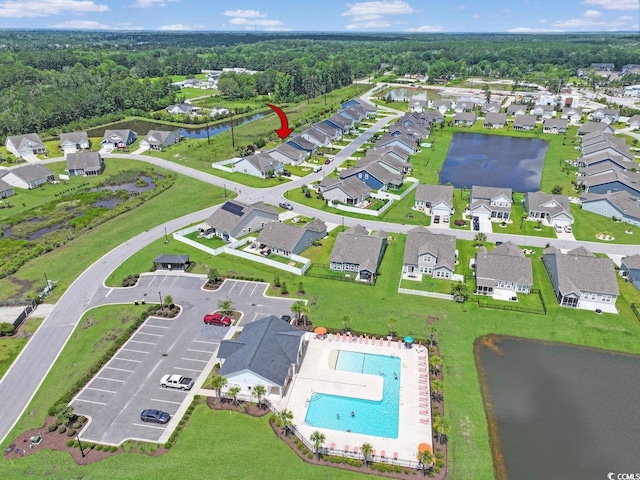 232 Angel Wing Dr, Myrtle Beach, SC 29588 - aerial perspective of suburban area featuring a pool and a large body of water