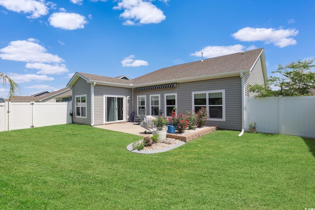 232 Angel Wing Dr, Myrtle Beach, SC 29588 - back of house with a fenced backyard, a patio area, and roof with shingles