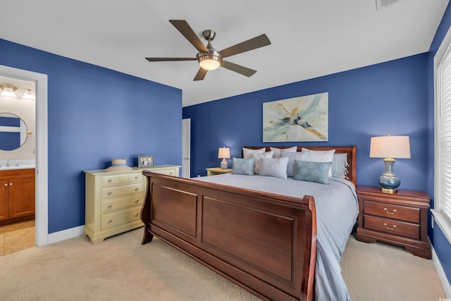 124 Turtle Creek Dr, Pawleys Island, SC 29585 - bedroom featuring light colored carpet, ensuite bathroom, a ceiling fan, and multiple windows