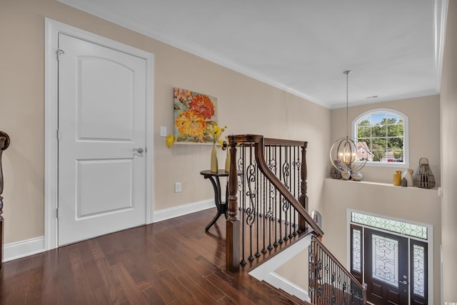 124 Turtle Creek Dr, Pawleys Island, SC 29585 - entryway with a chandelier, wood finished floors, and ornamental molding