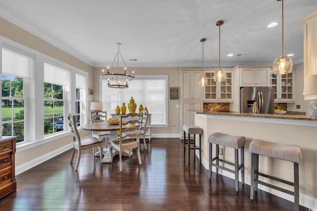 124 Turtle Creek Dr, Pawleys Island, SC 29585 - dining area with a chandelier, dark wood-style flooring, ornamental molding, and recessed lighting