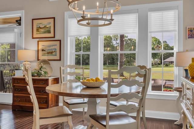 124 Turtle Creek Dr, Pawleys Island, SC 29585 - dining space featuring dark wood finished floors, a chandelier, and a ceiling fan